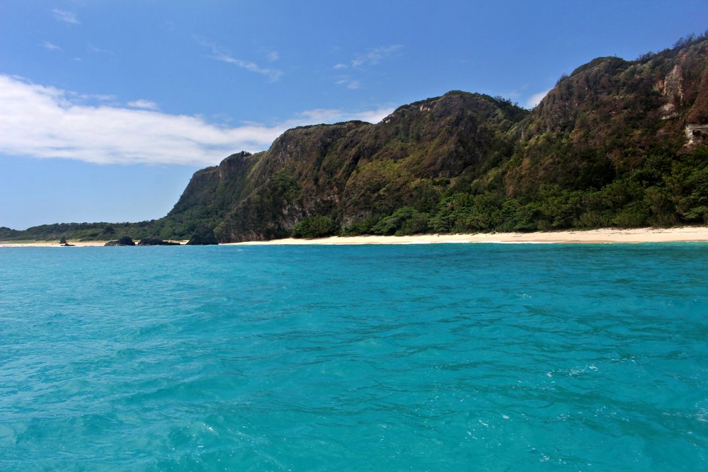 The inviting azure-colored waters of Calayan Island